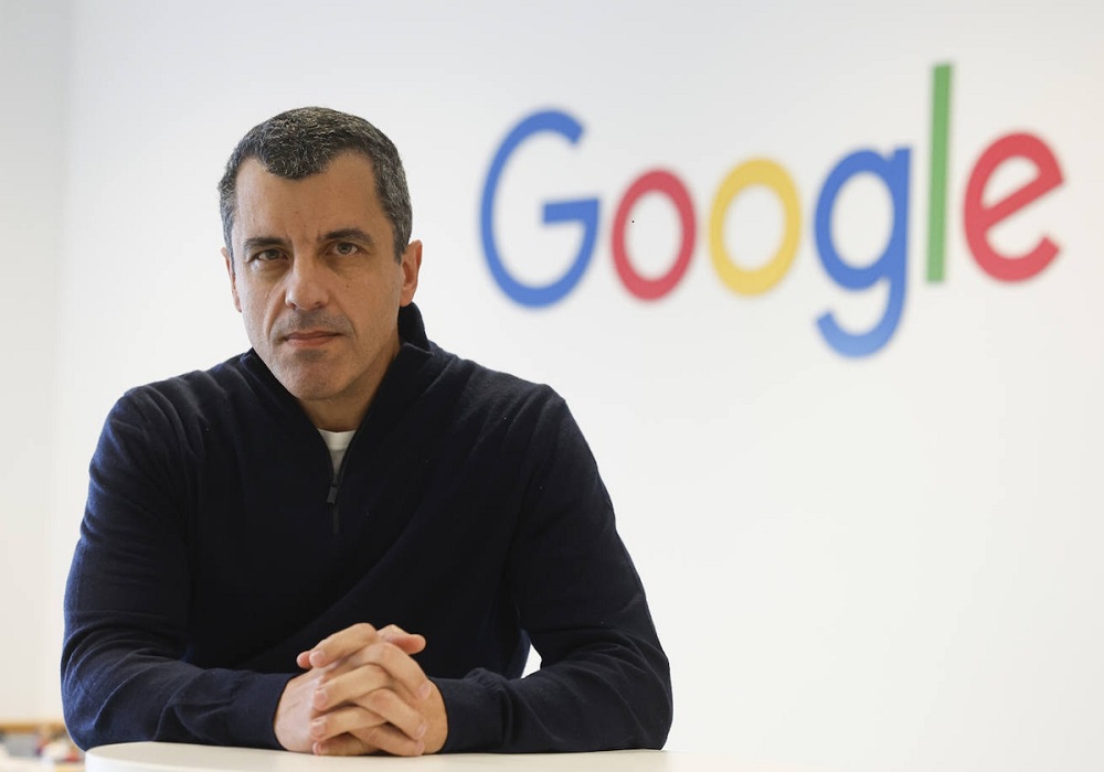 Bernardo Quintero, co-founder of VirusTotal, standing in front of a Google logo.