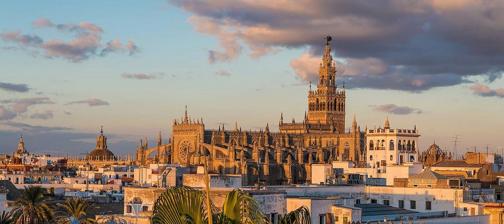 Exterior view of Sevilla's Cathedral, showcasing its Gothic architecture and grandeur.