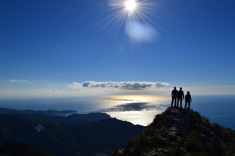 El Cielo, a wonderful view of its top, with 3 friends in front of the sun.