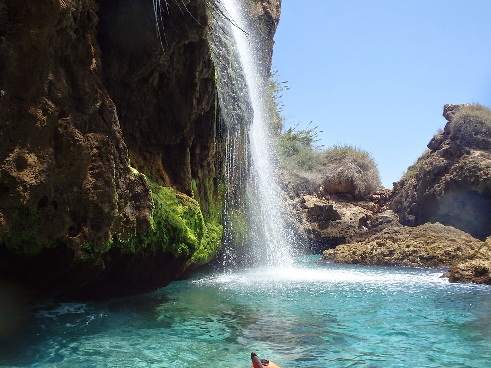 Marro beach's waterfalls, fresh mountain water cascades down into the sea.
