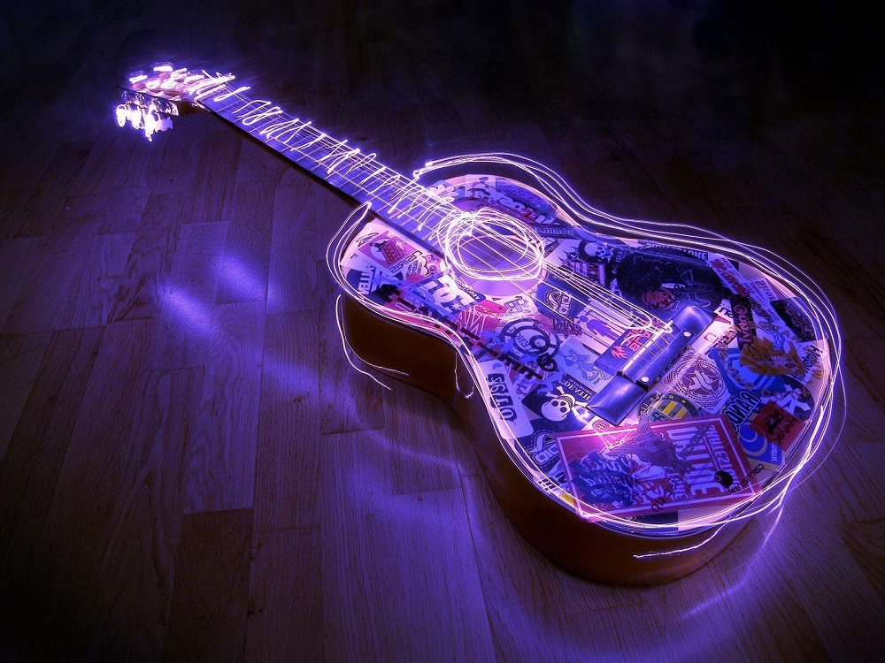 A modern Spanish guitar with neon lights.