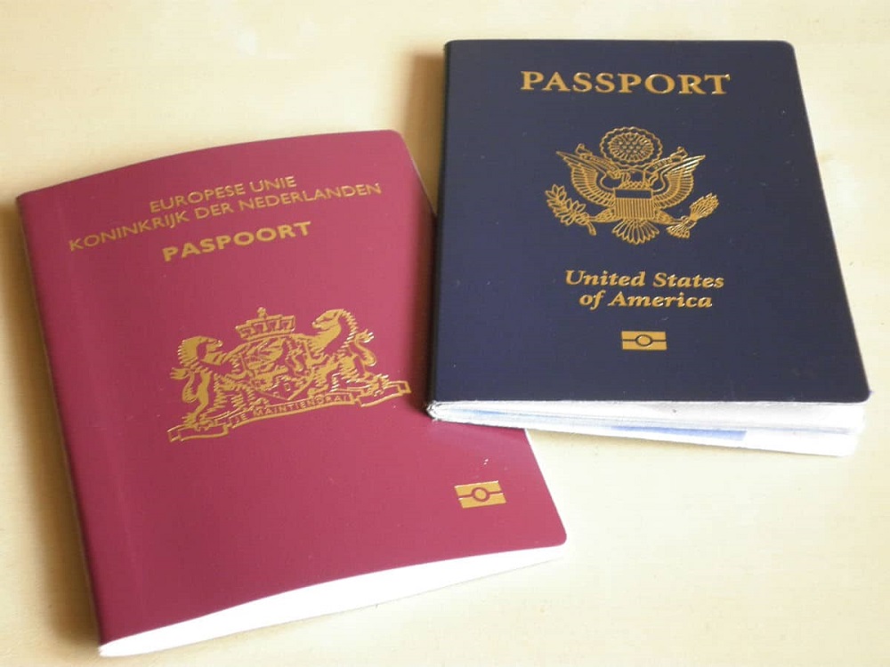 Two different passports, a clear example of a valid form of identification in Spain.