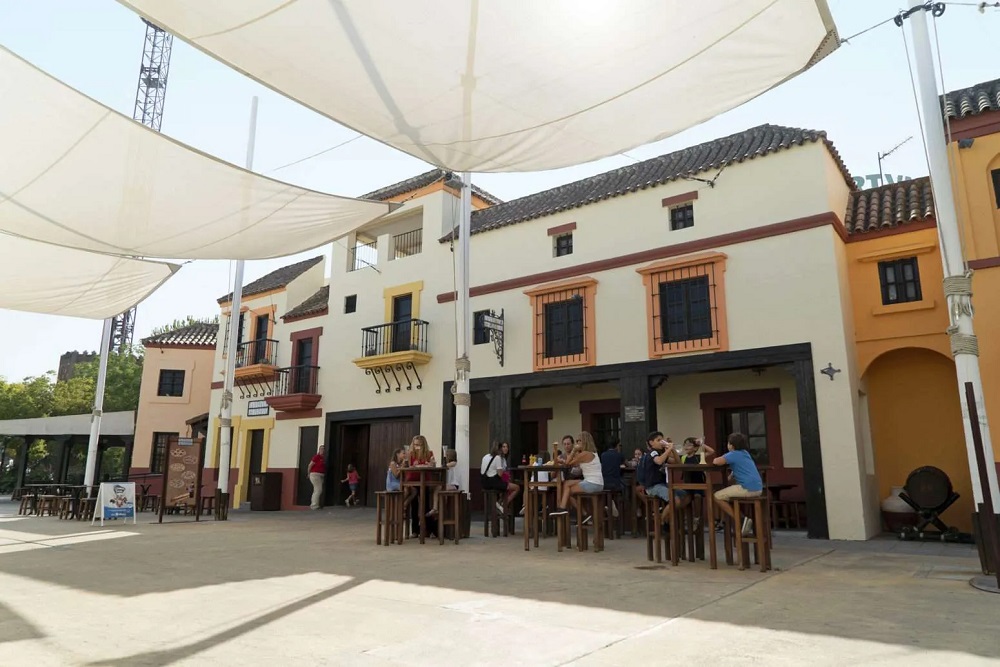 Visitors eating at Isla Mágica in Seville, Andalusia, Spain.