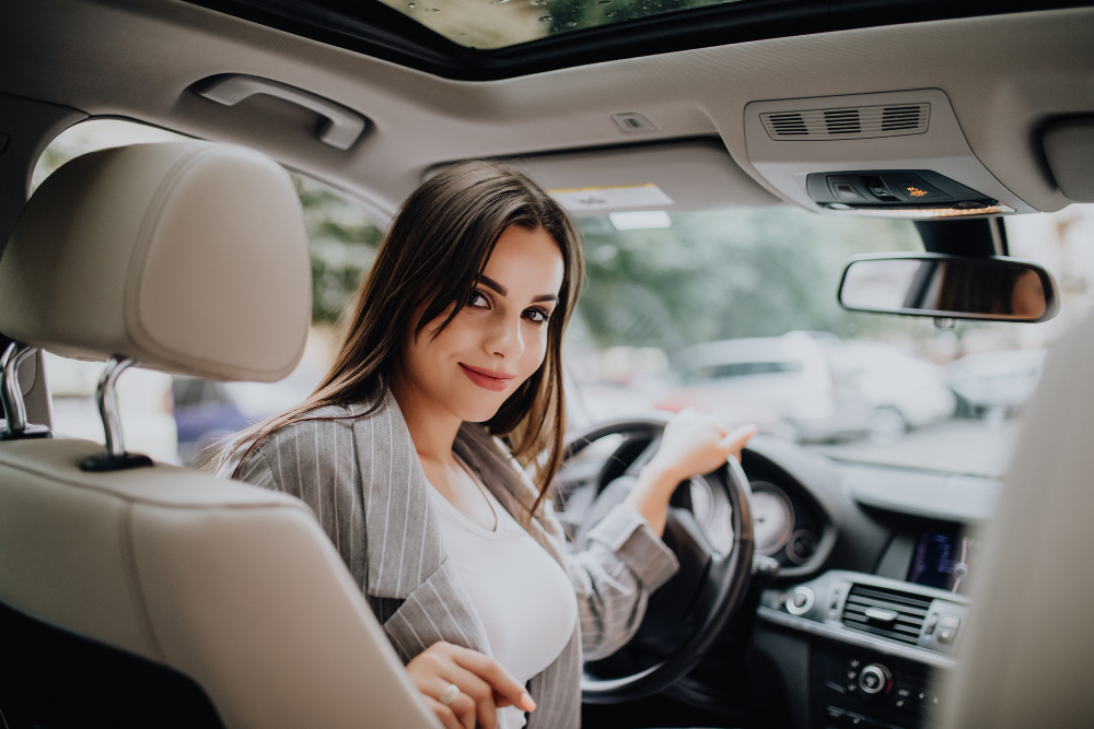 Woman showing the views in her car.