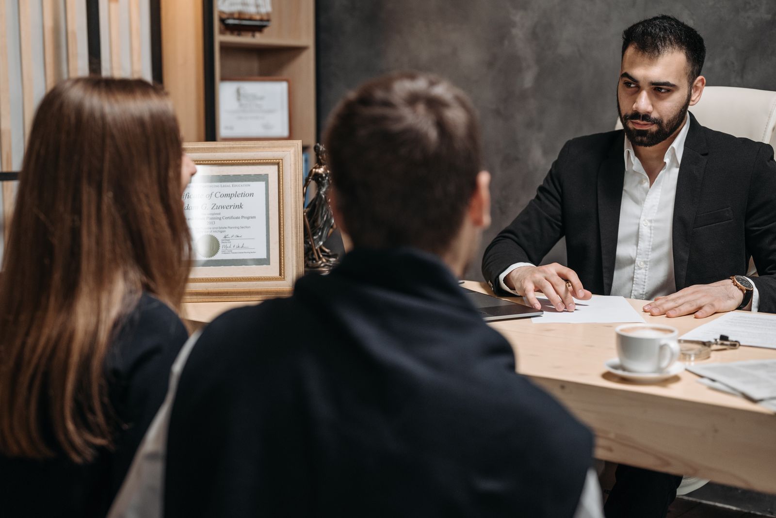 Lawyer and client reviewing a digital nomad visa document file for Spain