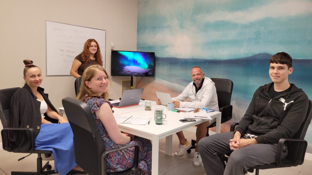 Small group class with a sea view mural during Spanish exam preparation at Vamos Academy in Málaga